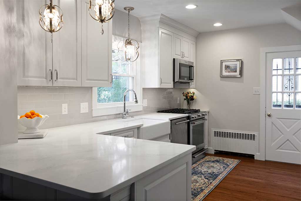 White kitchen countertops and cabinets