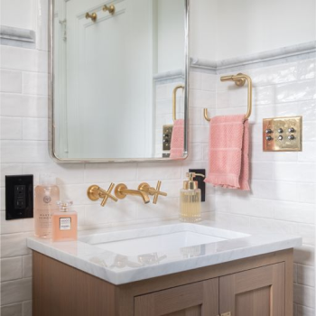 Bathroom with tile work and a pink hand towel